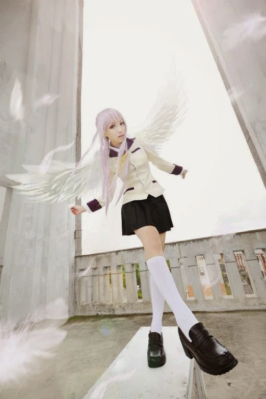 a person dressed up as an angel flying through the air