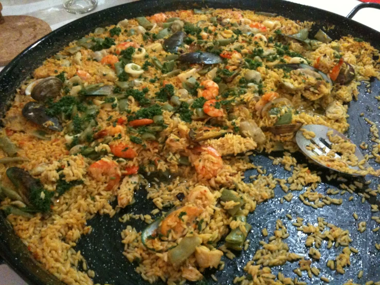 a plate of seafood on rice, in an oriental style