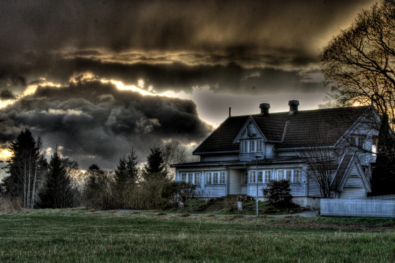 a house and the sky with many clouds