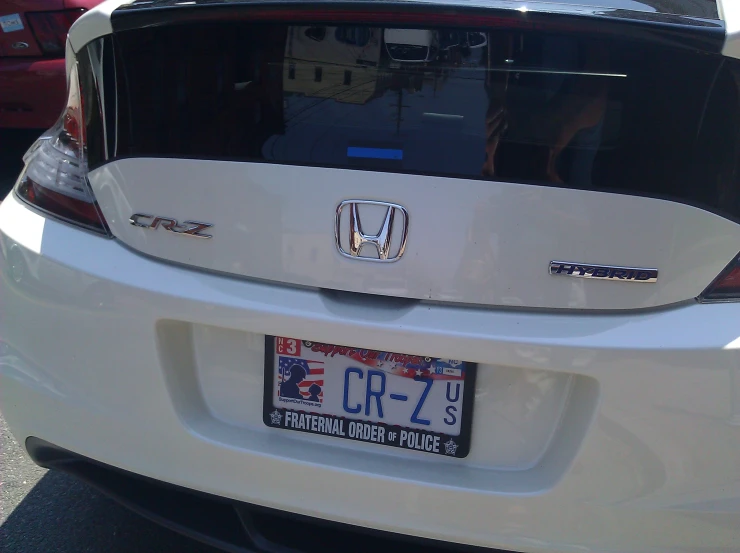 there is a license plate on a white honda civic civic