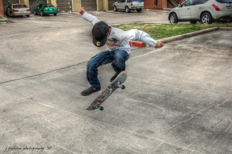 a skateboarder that is falling on the street