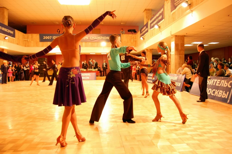 young people wearing costumes are performing the variety of dances