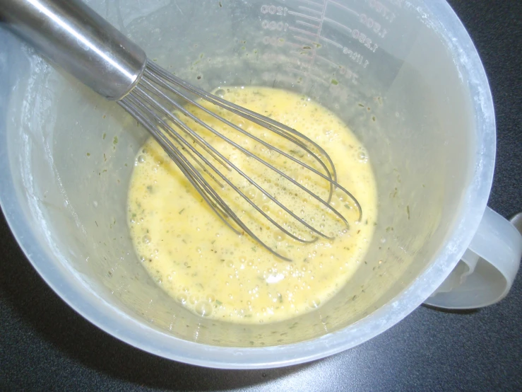 a mixture in a blender that is yellow