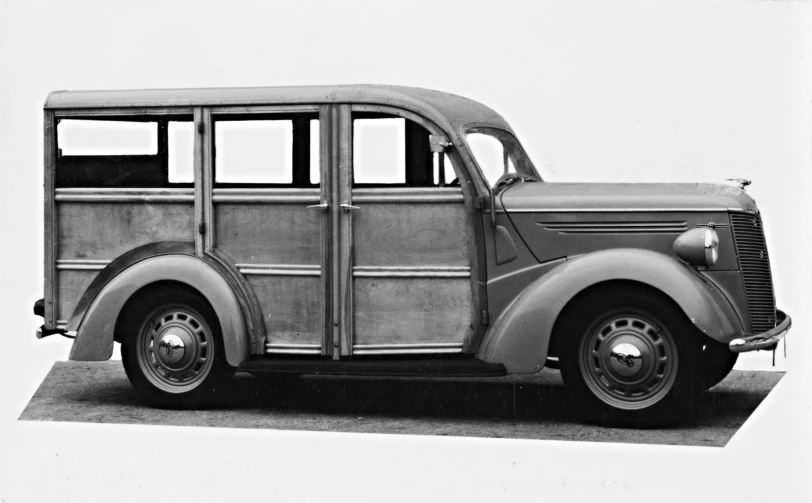 an old fashion car in the middle of the 20th century