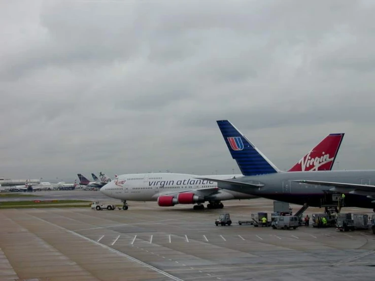 three airplanes on the tarmac waiting to be loaded