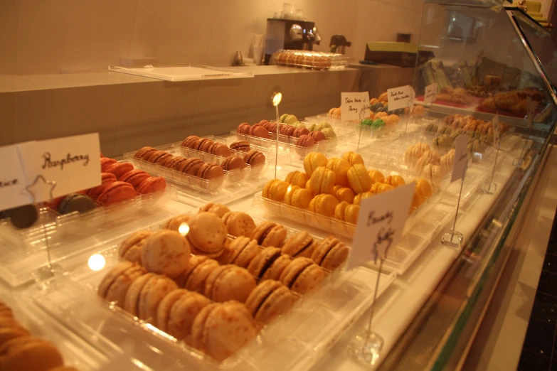 the counter is full of a variety of pastries