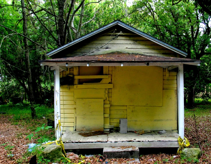 a small building with steps sitting next to it