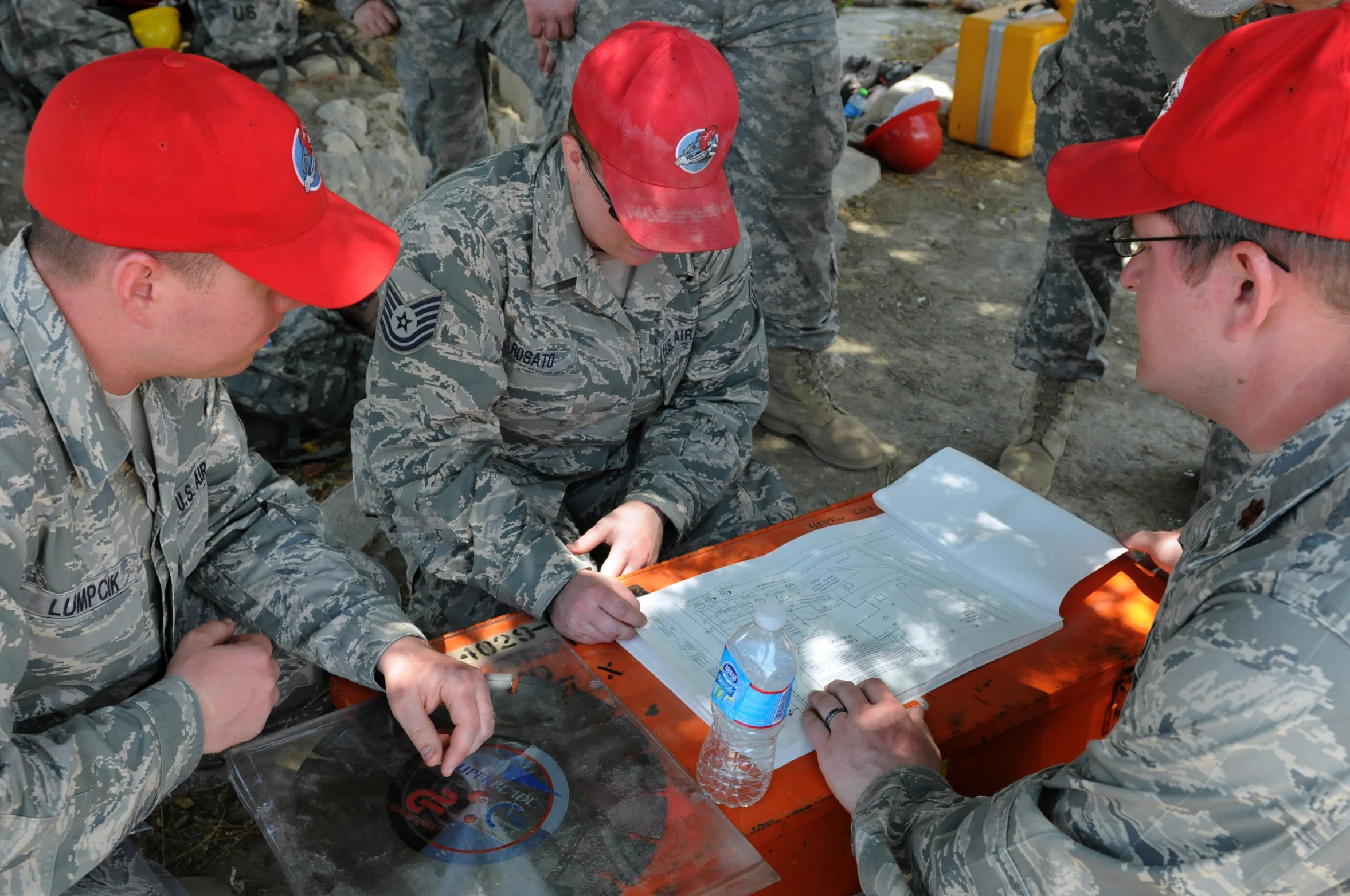 some soldiers wearing red hats on a table