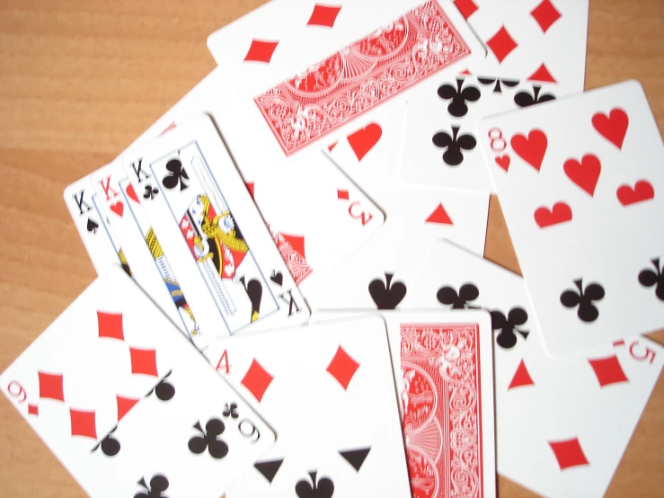 a collection of playing cards including fours and fours