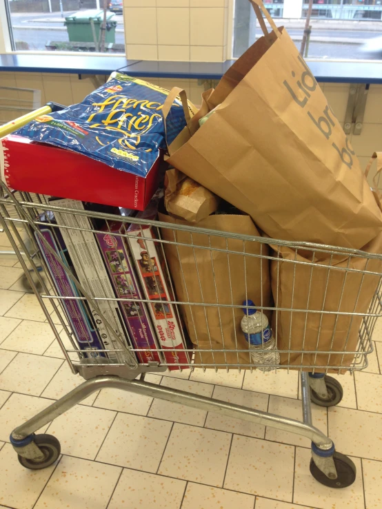 a shopping cart filled with books and other books