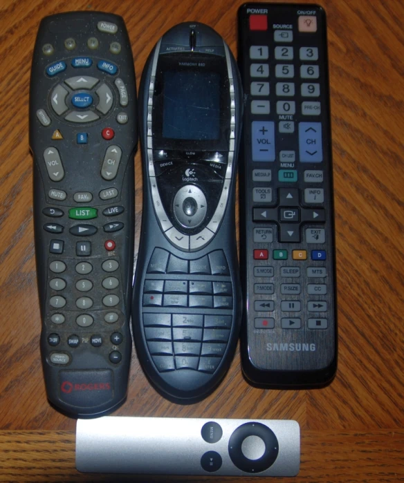 the remote control has been placed next to the two remotes