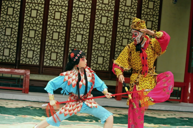 a couple is dressed up as an asian geisha and dancing