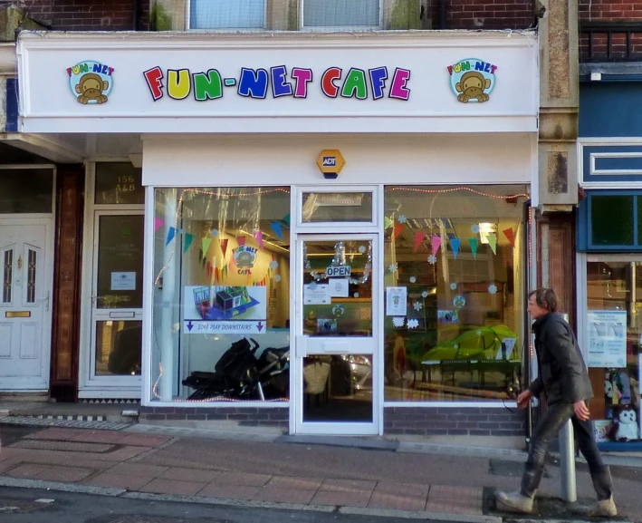 a street corner with a storefront displaying bunting cake