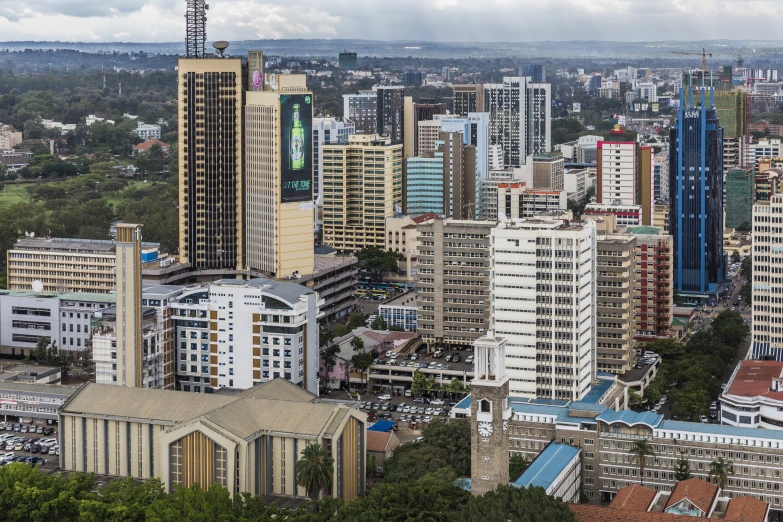 an aerial view of many skyscrs in a city