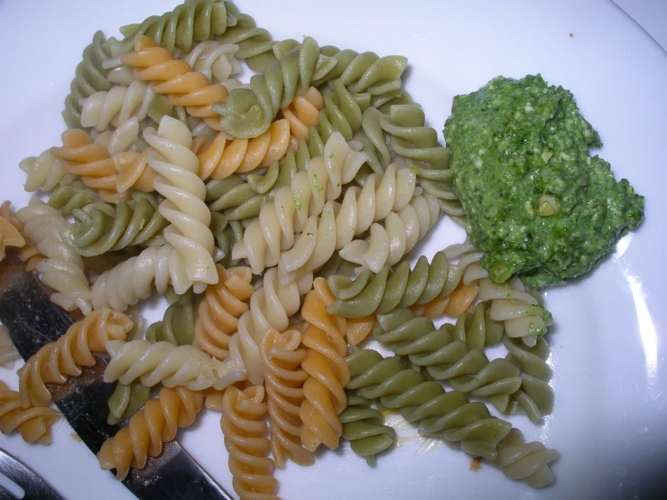 pasta, broccoli and other vegetables on a white plate