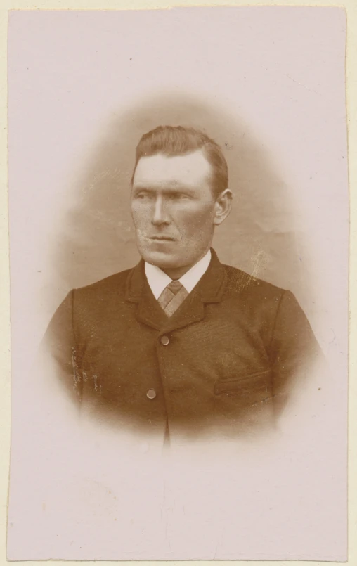 an old sepia po of a man in a suit