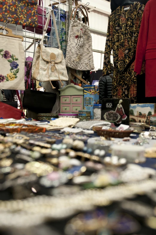 a table filled with lots of on and cloth