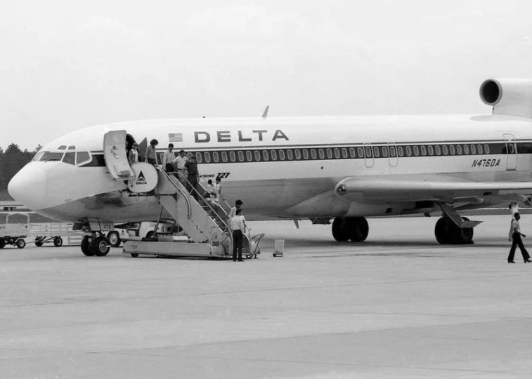 a large commercial airliner with its stairs down