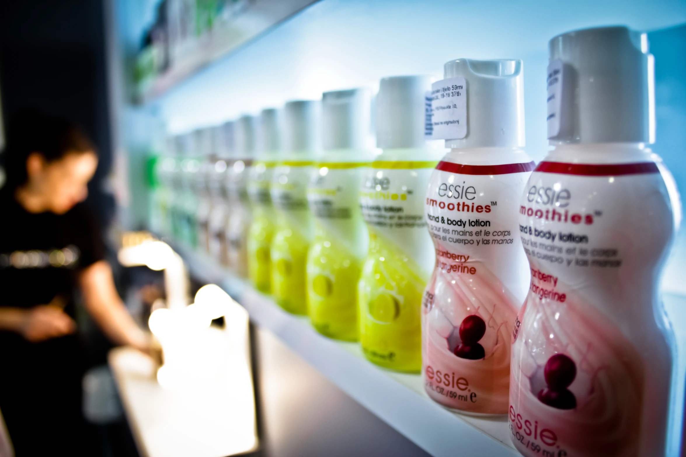 a counter with a number of bottles of different kinds of hair products