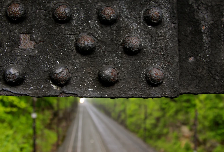 a large part of a rail with lots of holes in it