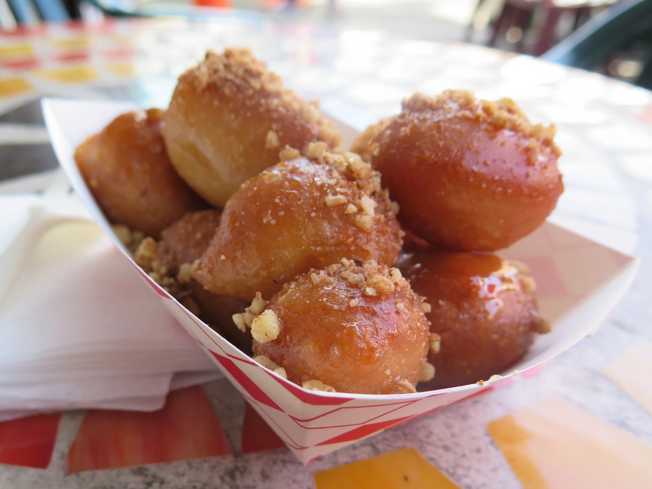 a bunch of donuts on a plate ready to be eaten