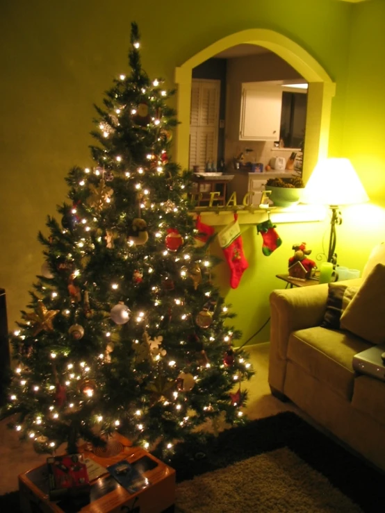 a christmas tree is lit up in a living room