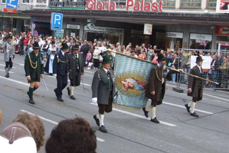 a crowd of people that are walking in the street