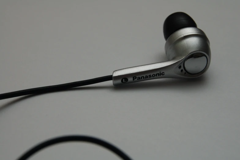 a pair of ear buds with the name panasonic on them