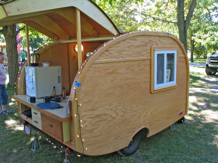 an outdoor vehicle has a sink and oven