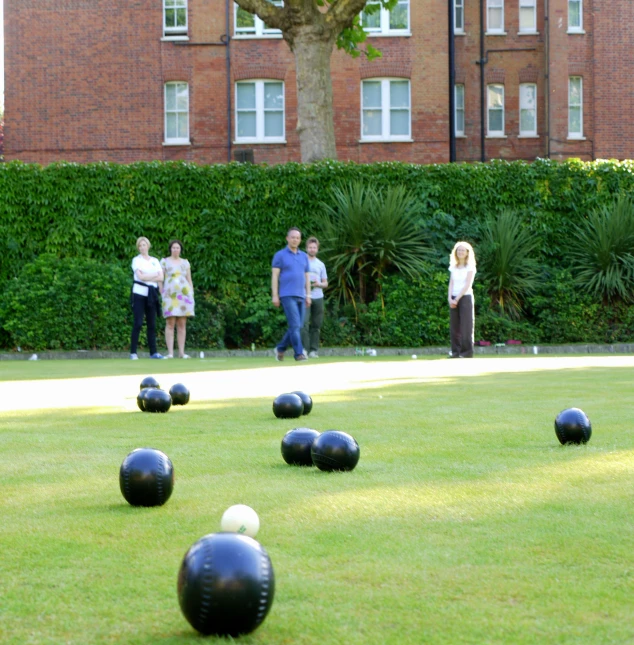 a group of people playing a game of bowling