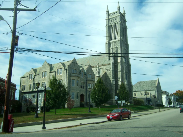 a large church on the corner of a street