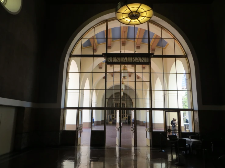 the view of an arched window from inside the building