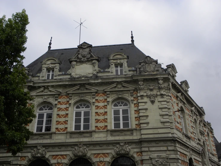 this is a building with many windows and a steeple