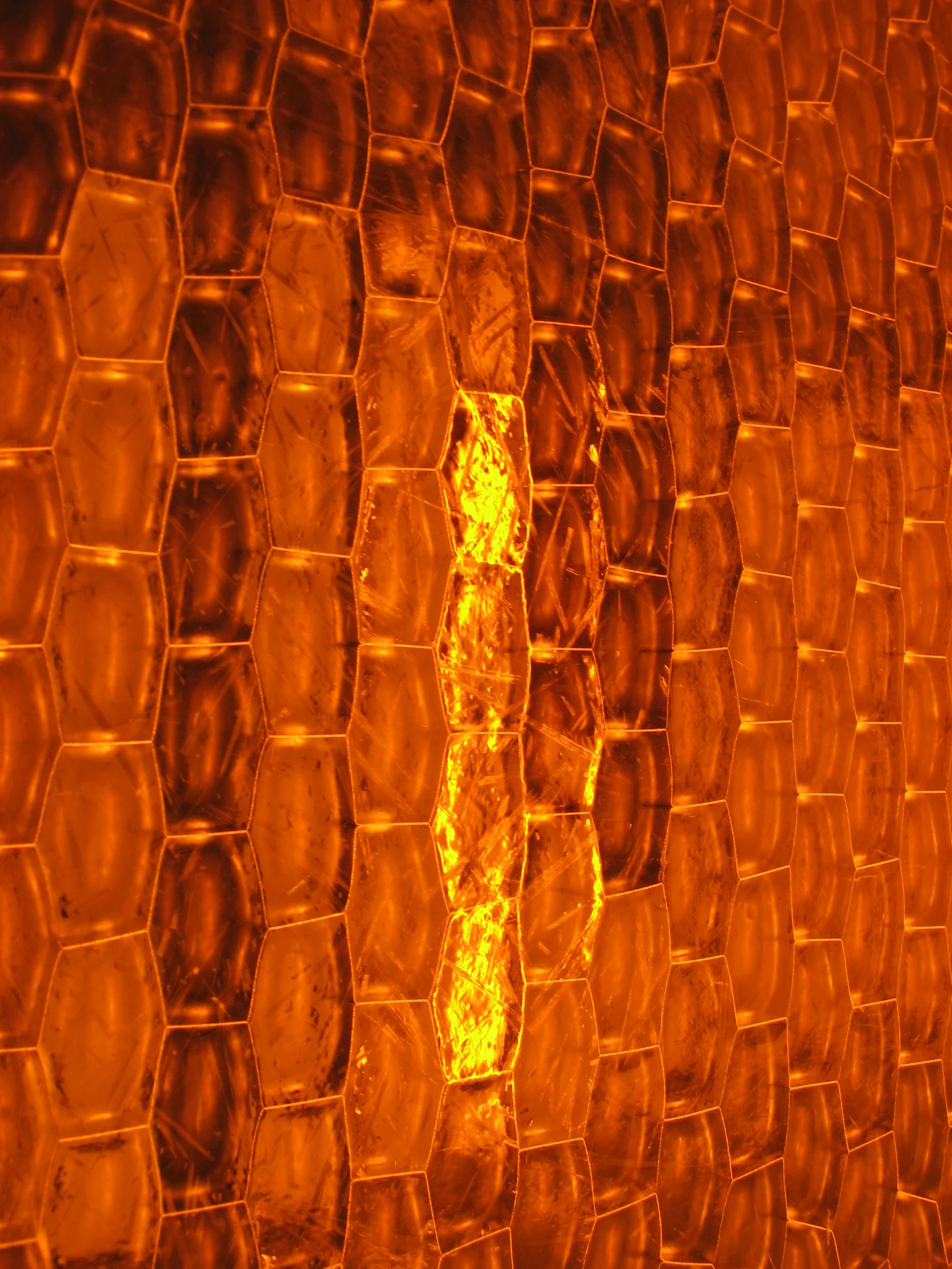 orange textured glass in the middle of the wall