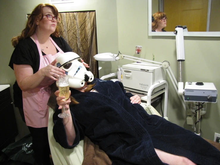 a person in a dental room holding a syg