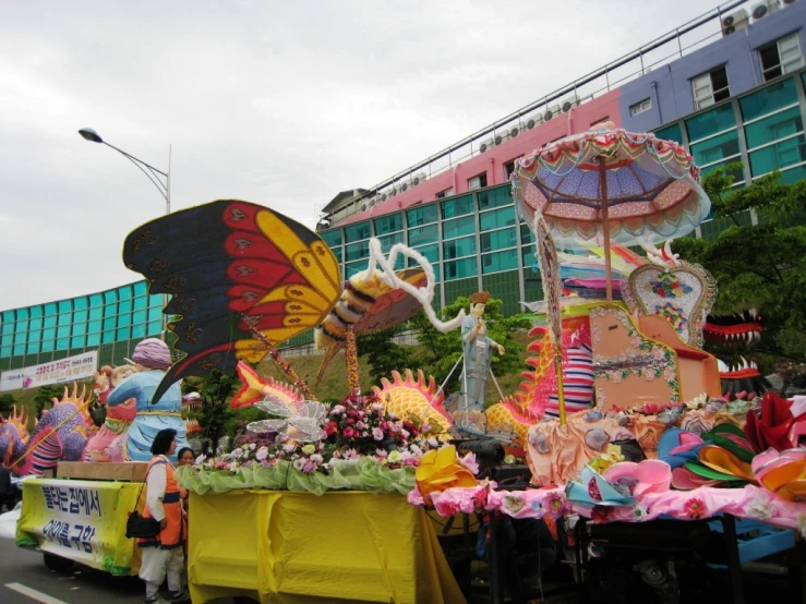 a group of people standing around a float