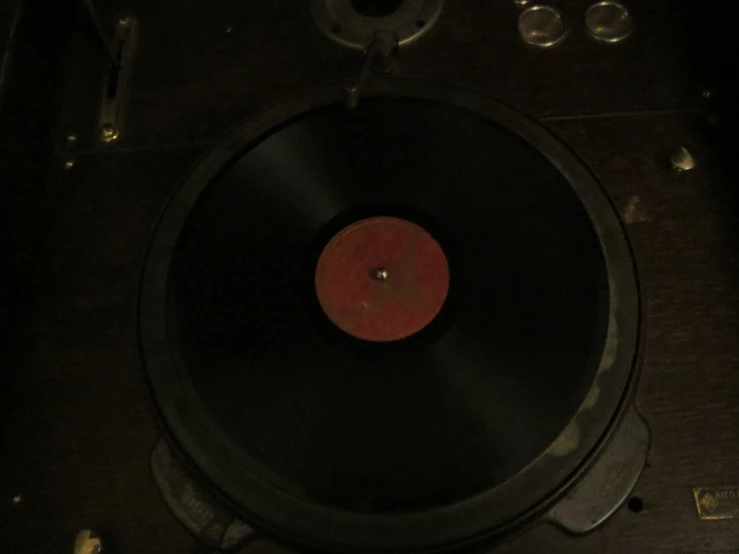 a dj mixing on to of a record player