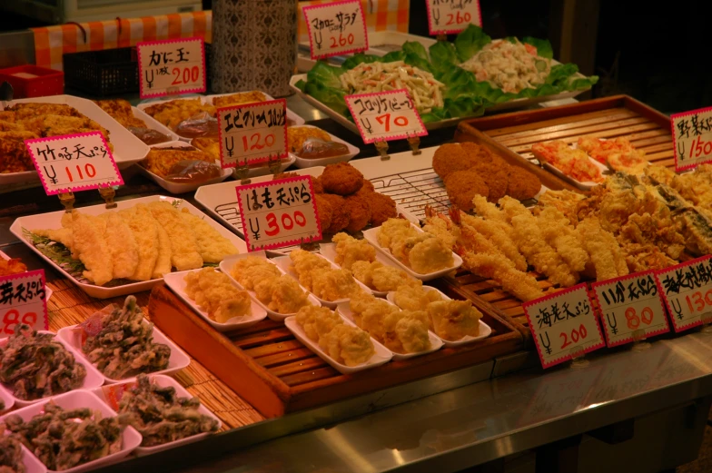 a number of trays of food on display