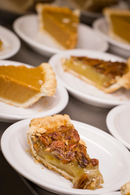 some pieces of pie sitting on plates on a table