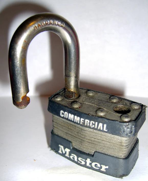a metal padlock with a steel d - type lock on it