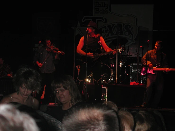 a group of people with musical instruments at a music concert