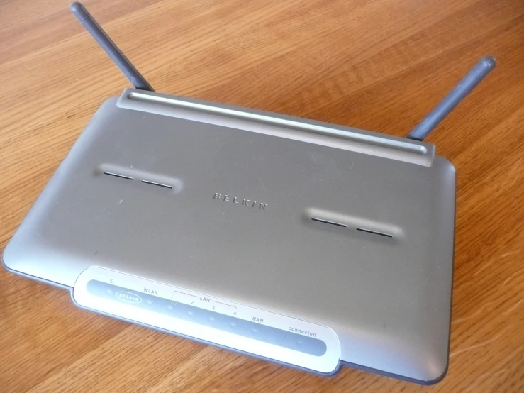 an image of a grey electronic device sitting on a table