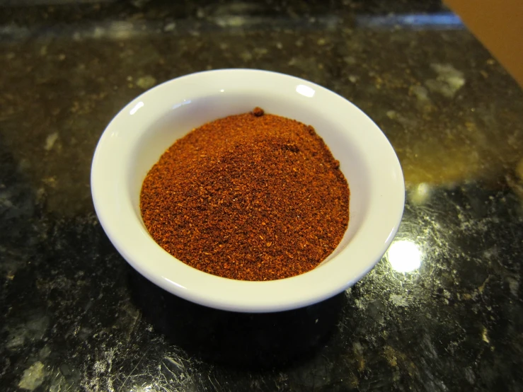 a close up of a bowl of food on a counter