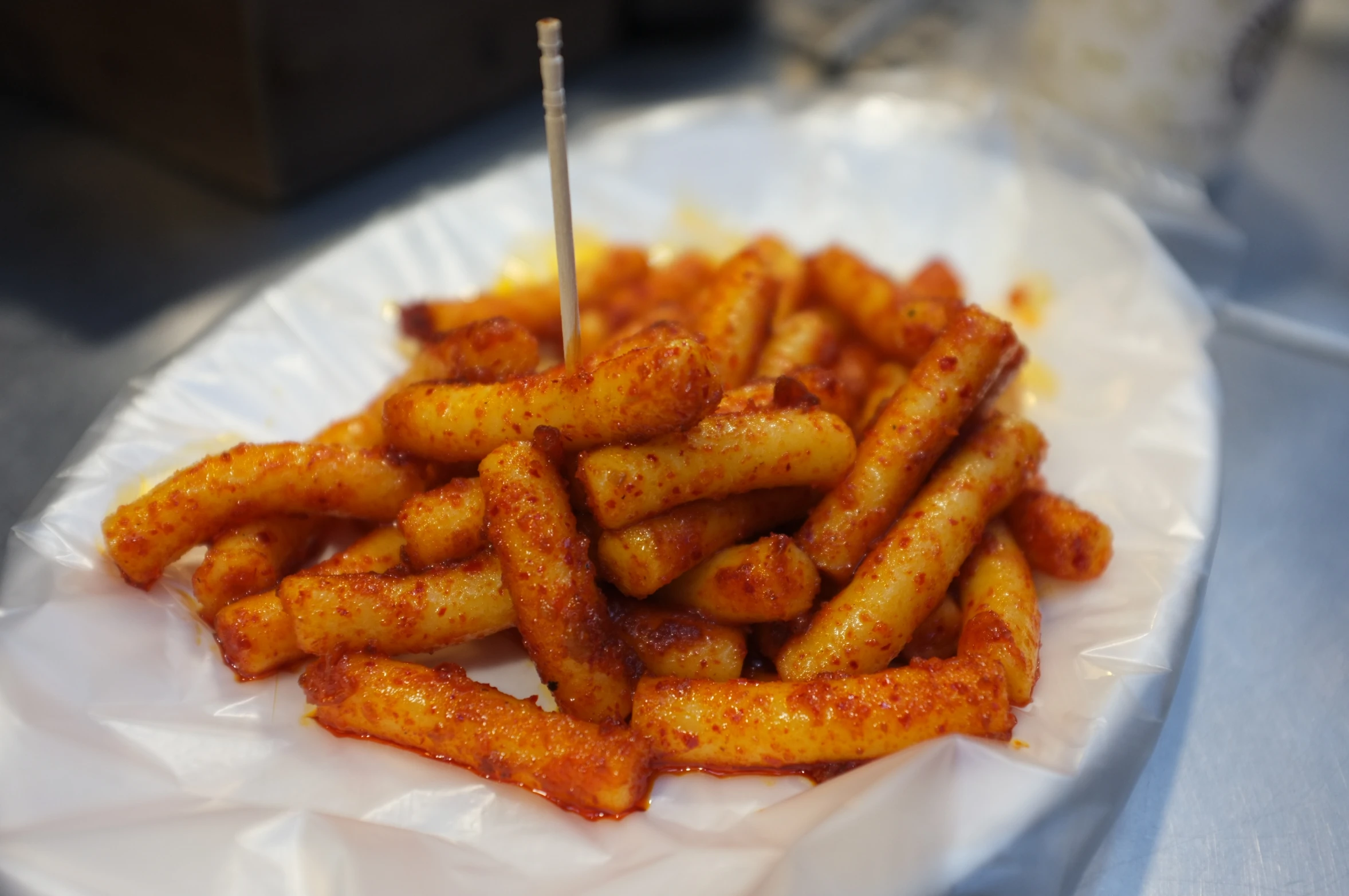 a plate topped with french fries covered in ketchup