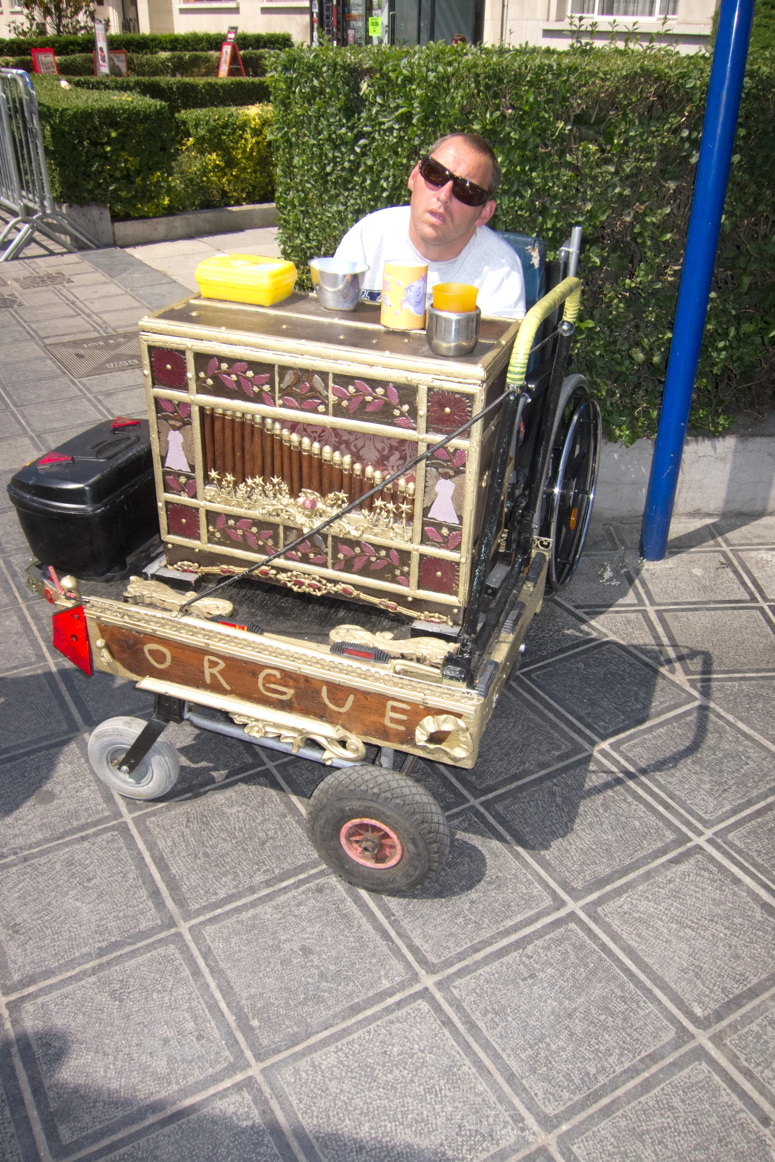 a man sitting in a small wooden cart