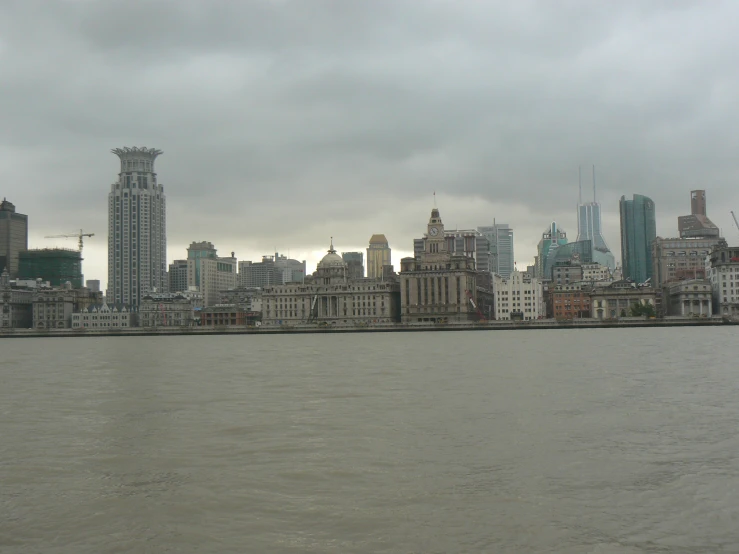 a city with lots of tall buildings on the water