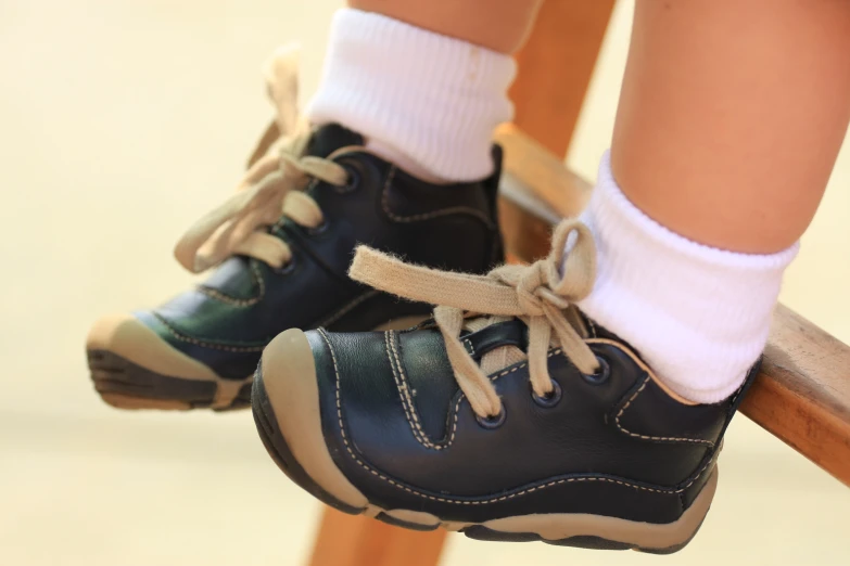 a close up of a child's shoe wearing a socks