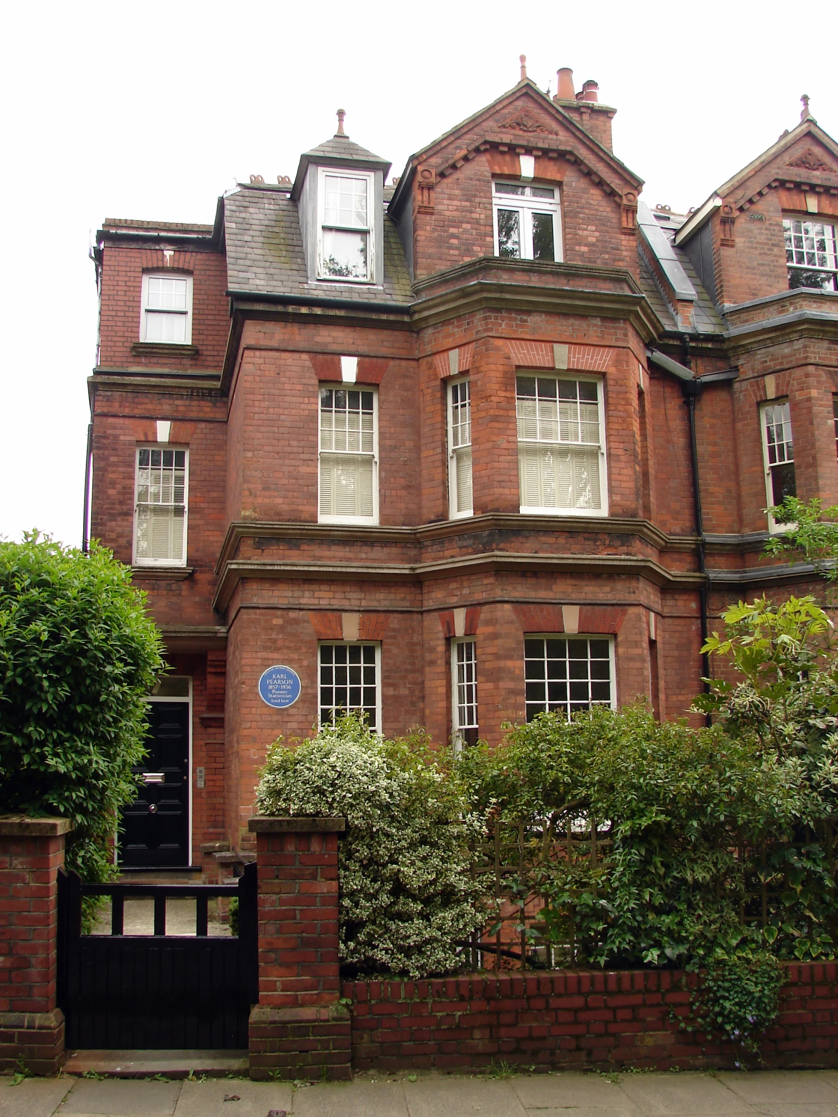 a very big pretty brick building with some trees