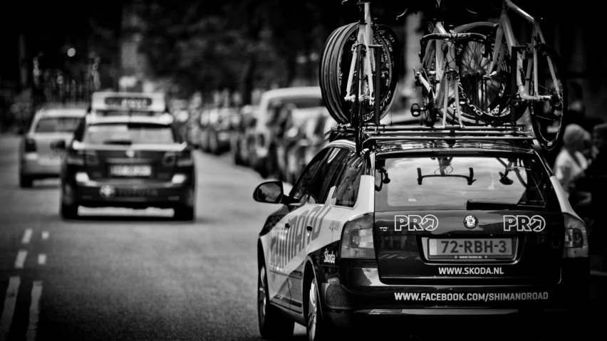 a car with bicycles strapped on the roof