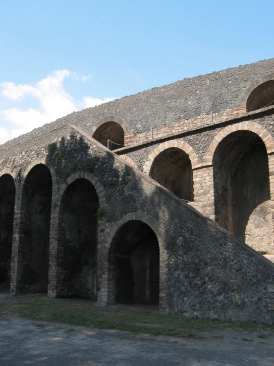 a big stone building with some very long arches